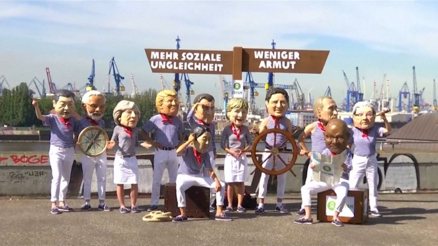 Oxfam campaigners dressed as Trump and other world leaders protest inequality at G20
