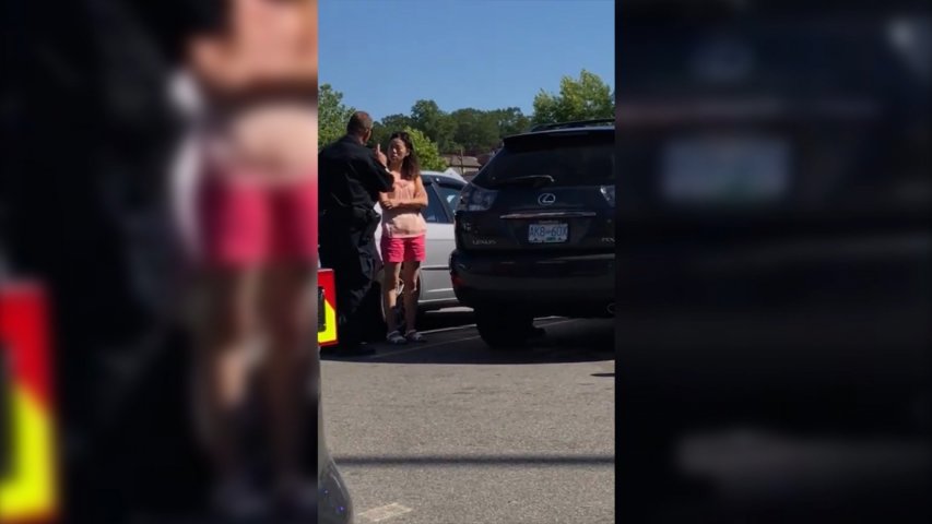 Police officer filmed yelling at mother for leaving children in hot car