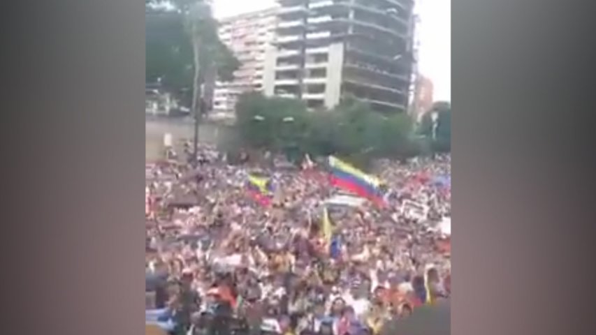 Thousands march in Caracas to mark 100 days of resistance