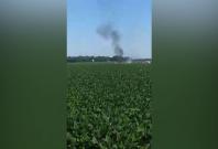 Video shows aftermath of fatal mid-air military plane explosion and crash Video shows aftermath of fatal mid-air military plane explosion and crash