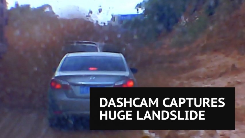 Huge landslide buries eight vehicles on busy road in China