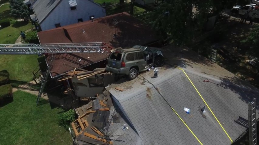 Out of control car goes airborne and crashes into roof of Missouri home