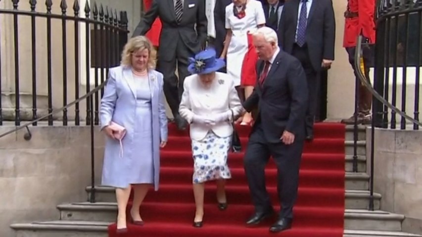 Canadian official touches the arm of the Queen, breaching royal protocol