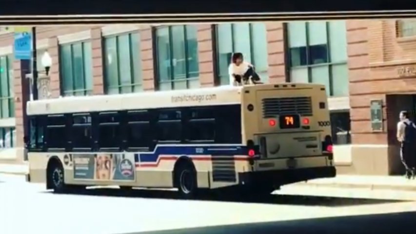 Chicago man spotted catching a ride on top of a bus like a boss