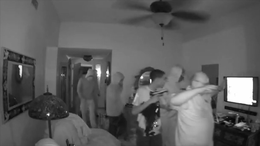 CCTV footage shows eight suspects in home invasion