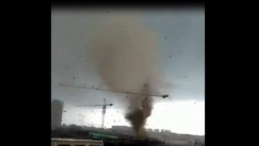 Footage shows tornado swirling above town in northern China