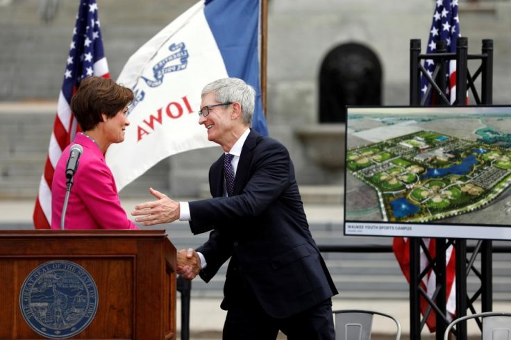 apple ceo tim cook and iowa governor kim reynolds