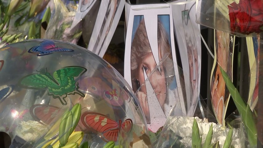 Crowds lay flowers for Princess Diana outside Kensington Palace