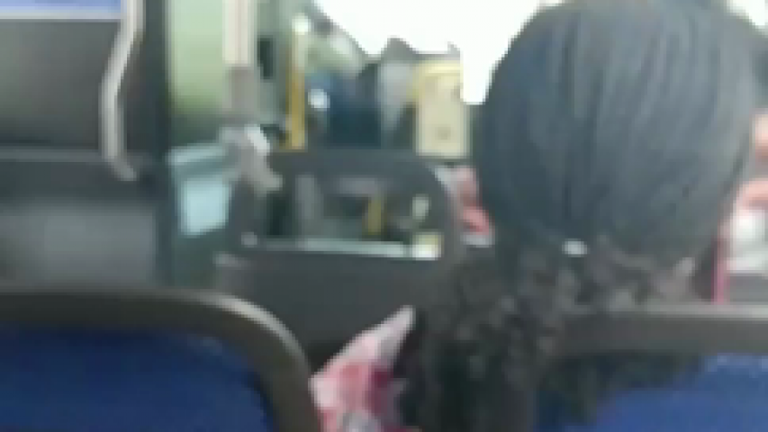 Maryland bus driver reads newspaper while at the wheel