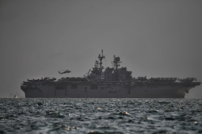 U.S Navy's USS America, which is supporting ongoing search for missing crew members of USS John McCain,...