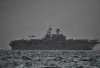 U.S Navy's USS America, which is supporting ongoing search for missing crew members of USS John McCain,...