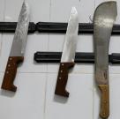 A collection of knives hang on the wall of the operating room-themed fast food restaurant in Damanhour, Egypt, August 1, 2017. Picture taken August 1, 2017. REUTERS/Mohamed Abd El Ghany