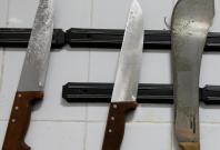 A collection of knives hang on the wall of the operating room-themed fast food restaurant in Damanhour, Egypt, August 1, 2017. Picture taken August 1, 2017. REUTERS/Mohamed Abd El Ghany