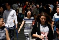 Office workers head for lunch at central business district in Singapore