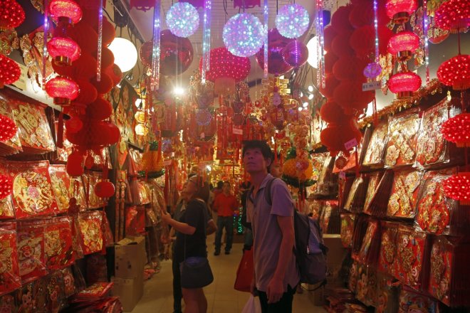 People shop for new year decorations ahead of the Lunar New Year in Chinatown in Singapore