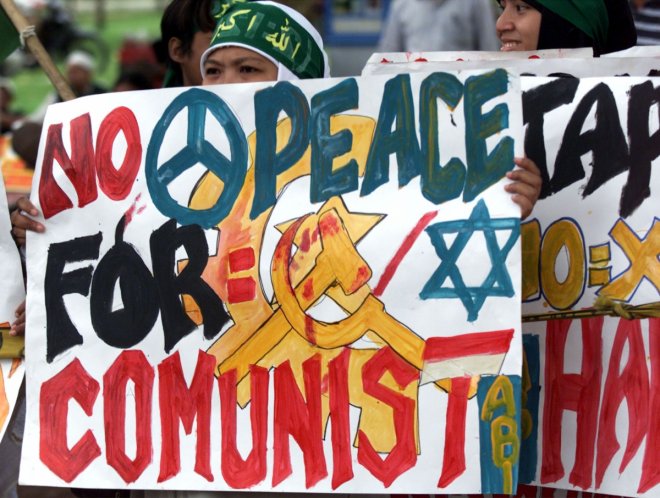 ANTI-COMMUNISTS PROTEST OUTSIDE THE PRESIDENTIAL PALACE IN JAKARTA.