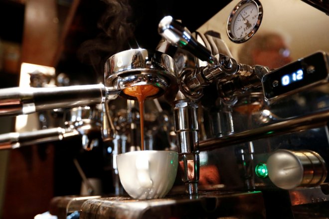 Espresso is poured in cup at Ridders Coffee roastery in Berlin