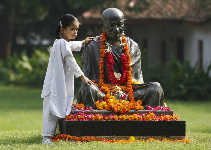 A school boy dressed as Mahatma Gandhi takes part in a march to mark the 143rd birth anniversary of Gandhi in the western Indian city of Ahmedabad October 2, 2012. Mahatma Gandhi, also known as the 