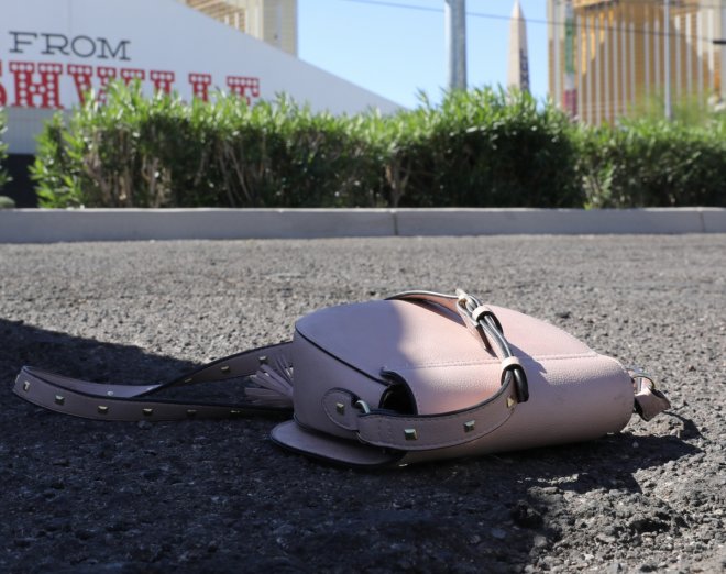 A handbag is seen on the street next to the site of the Route 91 music festival mass shooting outside the Mandalay Bay Resort and Casino in Las Vegas, Nevada, U.S. October 2, 2017. REUTERS/Lucy Nicholson