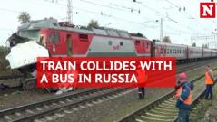 At least 16 killed as bus torn apart by speeding train in Russia