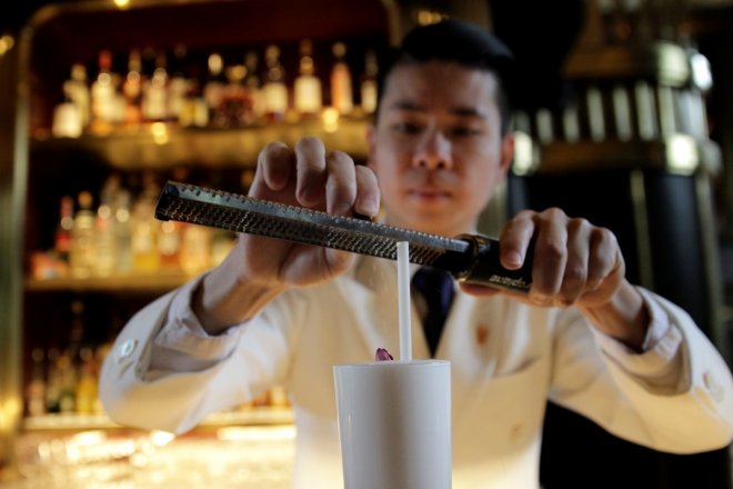 A barman prepares an Imperial Fizz Nouveau at the Atlas Bar