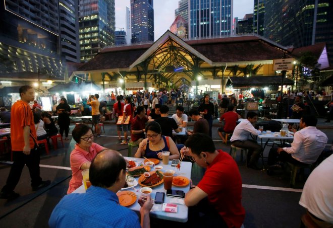 People eat at Lau Pa Sat food centre in Singapore July 29, 2016