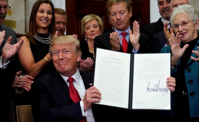 U.S. President Donald Trump smiles after signing an Executive Order to make it easier for Americans to buy bare-bone health insurance plans and circumvent Obamacare rules at the White House in Washington, U.S.