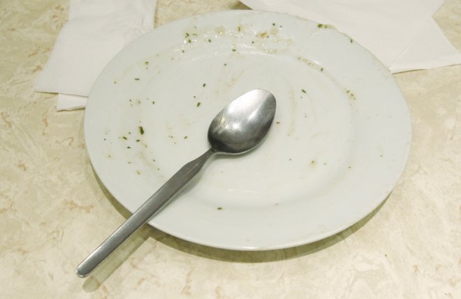 An empty plate is left at a table following a Pie and Mash Club meeting at G. Kelly's pie and mash shop