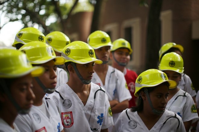 Students of the Francisco Menendez National Institute prepare to participate in a national earthquake...