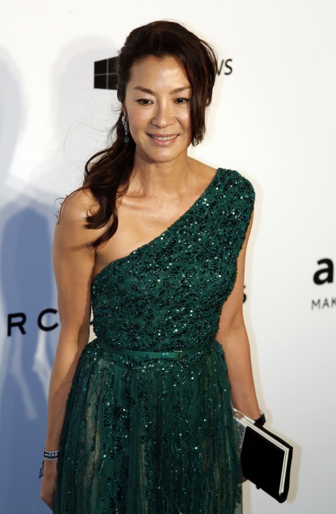 Malaysian actress Michelle Yeoh poses upon arrival at the Foundation for AIDS Research's (amfAR) inaugural fundraising gala in Hong Kong March 14, 2015.