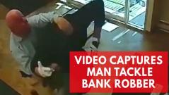 Watch dramatic moment man tackles armed bank robber like a pro football player