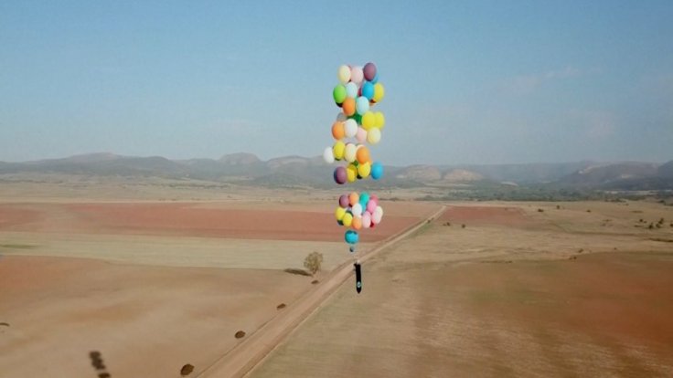 British man flies over South Africa using only a chair tied to helium balloons British man flies over South Africa using only a chair tied to helium balloons