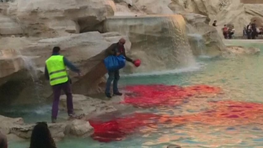 Romes Trevi Fountain runs red after man pours dye in water