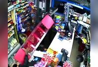 Watch unarmed shopkeeper fending off knife-wielding robbers in Northampton