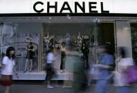 people walking past Chanel