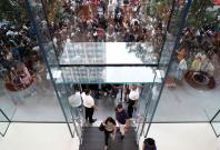 People queue to buy iPhone X during its launch at the Apple store in Singapore