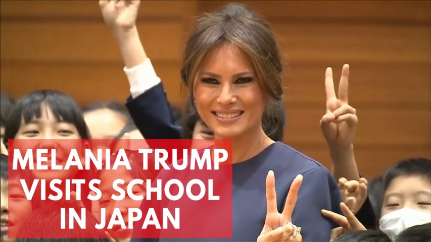 Melania Trump visits school in Tokyo, writes peace in calligraphy