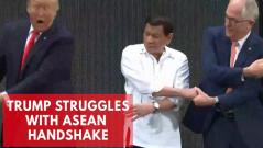 Donald Trump struggles with ASEAN group handshake