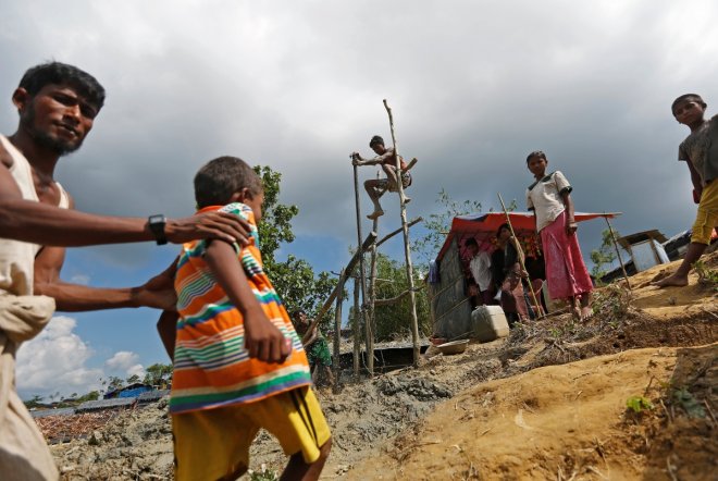 Rohingya refugees manually drill borewell at Palong Khali refugee camp near Cox's Bazar