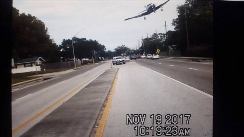 Dashcam footage shows small plane clipping a tree and crashing onto a Florida highway