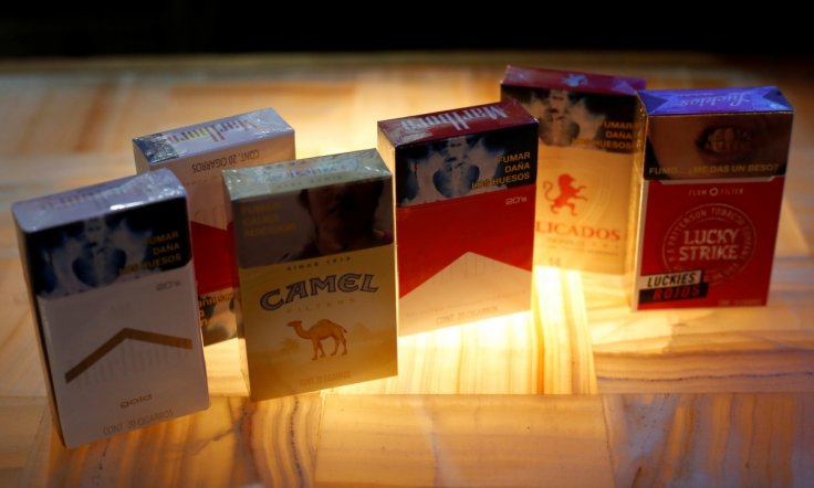 Packs of Marlboro cigarettes, a pack of Camel cigarettes, and a pack of Lucky Strike cigarettes Packs of Marlboro cigarettes, a pack of Camel cigarettes, and a pack of Lucky Strike cigarettes