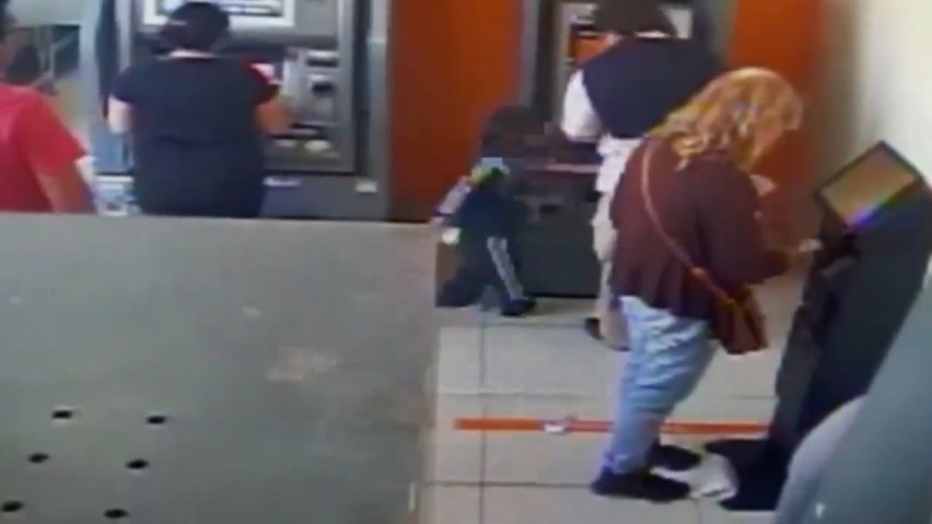 Four-year-old swipes cash straight from under ATM users nose