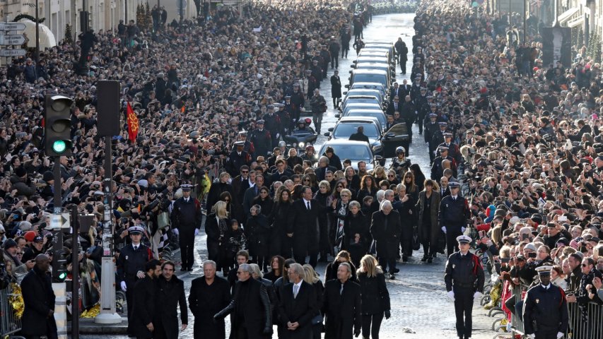 Thousands gather in Paris for French rock legends funeral