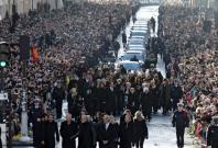 Thousands gather in Paris for French rock legends funeral