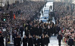 Thousands gather in Paris for French rock legends funeral