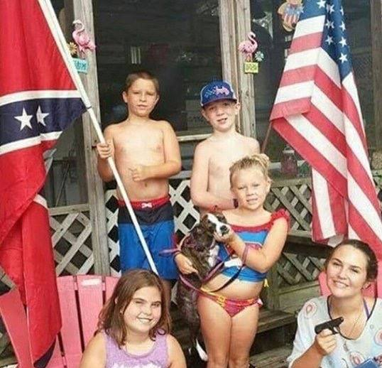 Keaton Jones and his family holding the Confederate flag and the flag of the US Keaton Jones and his family holding the Confederate flag and the flag of the US