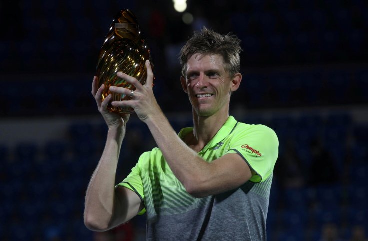 Kevin Anderson of South Africa holds the trophy after wining his match against Roberto Bautista Agut of Spain. 