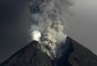 Mount Merapi volcano spews ash as seen from Kali Tengah 