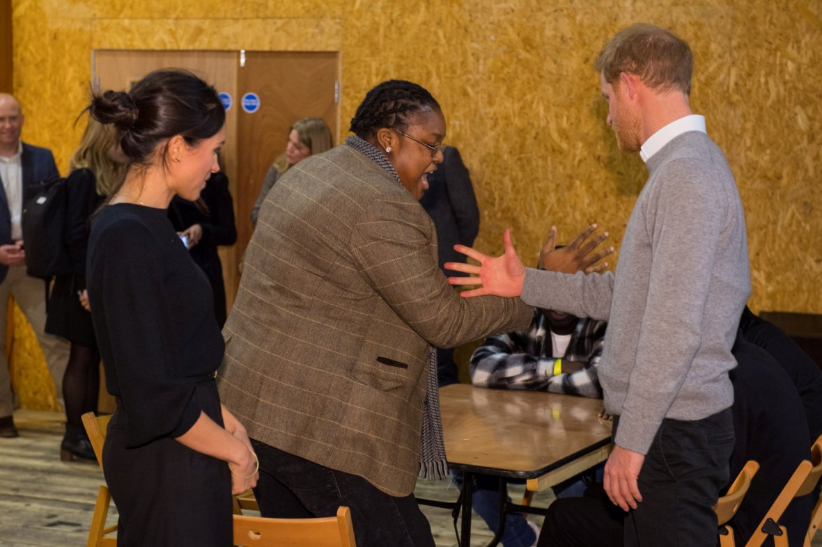 Prince Harry and his fiancee Meghan Markle meet DJ Remi Aderemi during a visit to radio station Reprezent FM