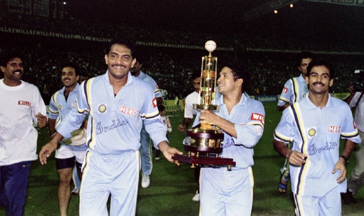 UBILANT INDIAN CRICKETT PLAYERS GREET CROWD AFTER BEATING WEST INDIES IN CRICKET ASSOCIATION OF BENGAL'S DIAMOND JUBILEE SIX NATION TOURNAMENT IN CALCUTTA. Jubilant Indian players (L-R) Kapil Dev, Captian Mohammed Azharuddin, Sachin Tendulkar (with Cup)